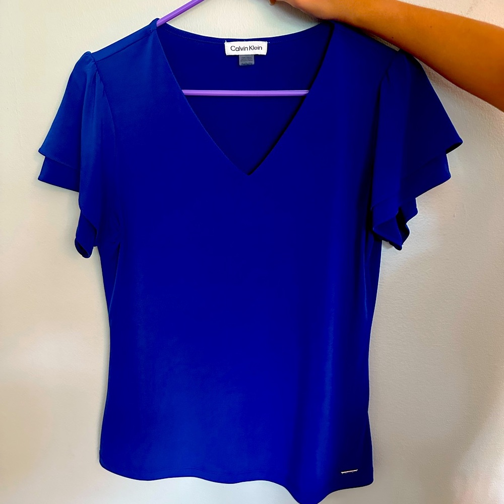 Blue Calvin Klein blouse.